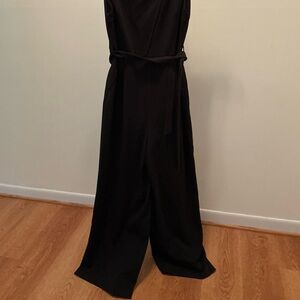Donna Karan Classic Black Jumpsuit with gold tone button, sleeveless.